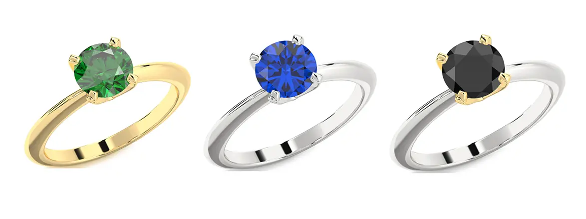 Three gemstone rings in gold and silver